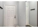 Bright condo entry with coat rack and mirror at 4228 Central Sarasota Pkwy # 1013, Sarasota, FL 34238