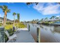 Relaxing waterfront dock with seating for enjoying the view at 4430 Wynkoop Cir, Port Charlotte, FL 33948