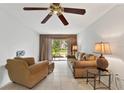 Living room with comfy seating and access to patio at 5889 Canal Dr # I4, Bradenton, FL 34207