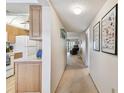 Hallway view of condo with kitchen and living room at 635 30Th Ave W # F206, Bradenton, FL 34205