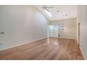 Spacious living room featuring hardwood floors and high ceilings at 6723 Approach Rd # 35, Sarasota, FL 34238