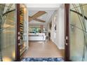 Bright and spacious entry with a wine cellar feature at 7139 Tamworth Pkwy, Sarasota, FL 34241
