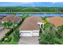 Single-Gathering home with two-car garage, located on a lakefront community at 7220 Whittlebury Trl, Lakewood Ranch, FL 34202