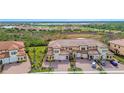 Community overview showcasing lakefront and townhome location at 10031 Crooked Creek Dr # 201, Venice, FL 34293
