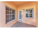 Inviting condo front door entry with sidelights and window at 1105 Gondola Park Dr # 1105, Venice, FL 34292