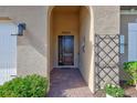 Welcoming front entry with a charming walkway and decorative accents at 215 Toscavilla Blvd, Nokomis, FL 34275