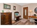 Bright entryway with hardwood floors and antique furniture at 2154 Lakewood Dr, Nokomis, FL 34275