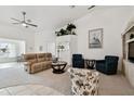 Spacious living room with comfortable seating, a large TV, and high ceilings at 2906 Captains Ct, Palmetto, FL 34221