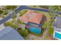 An aerial view showcasing a home with a pool and screened enclosure at 3318 Bayou Sound, Longboat Key, FL 34228