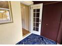 Front entry with access to interior hallway and storage at 3333 Ramblewood Ct, Sarasota, FL 34237