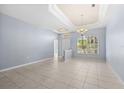 Bright and spacious living room with tile floors and recessed lighting at 408 Golden Harbour Trl, Bradenton, FL 34212