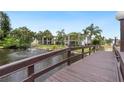 Wooden footbridge over a serene canal, offering scenic views at 5400 34Th W St # D12, Bradenton, FL 34210