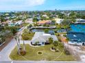 Bird's eye view of a single-story house on a canal at 5560 Shadow Lawn Dr, Sarasota, FL 34242