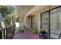 Private balcony with potted plants and seating at 6450 Wild Oak Bay Blvd # 238, Bradenton, FL 34210