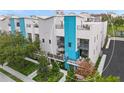 Modern townhouse with rooftop patio, city views in background at 72 N School Ave, Sarasota, FL 34237