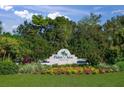 Palm Aire Country Club entrance with lush landscaping at 7304 W Country Club N Dr # 213, Sarasota, FL 34243