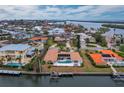 Aerial view of waterfront home with pool and private dock at 740 Old Compass Rd, Longboat Key, FL 34228