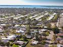 Aerial view of a neighborhood, showcasing the home's location near the water at 807 62Nd W St, Bradenton, FL 34209