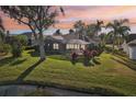 Home features a screened-in patio overlooking a pond at 8818 29Th E St, Parrish, FL 34219