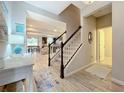 Bright and spacious entryway with stairs leading to the second floor at 12455 Trailhead Dr, Bradenton, FL 34211