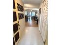 View through the entryway, showing the tiled floor and access to the living area at 1318 56Th W St # 1318, Bradenton, FL 34209