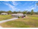 Aerial view of a ranch-style house with a spacious yard at 15409 Waterline Rd, Bradenton, FL 34212