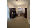 Bright dining room features built-in hutch and window at 1649 N Chamberlain Blvd, North Port, FL 34286