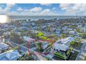 Aerial view of a house near the beach, with ocean views and surrounding neighborhood visible at 210 Willow Ave, Anna Maria, FL 34216