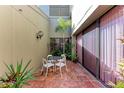 Relaxing courtyard with seating area, perfect for outdoor enjoyment at 360 Pine Run Dr, Osprey, FL 34229