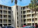 Condo building with palm trees and parking at 3756 Lake Bayshore # 509, Bradenton, FL 34205