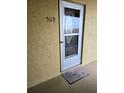 Inviting condo entry with a welcome mat at 3756 Lake Bayshore # 509, Bradenton, FL 34205