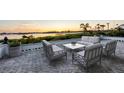 Elegant patio furniture on a brick patio overlooking the water at 419 Yacht Harbor Dr, Osprey, FL 34229