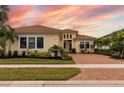 Beautiful home with brick paver driveway and landscaping at 4839 Pastel Ct, Sarasota, FL 34240