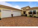 Two-car garage with paver driveway at 4839 Pastel Ct, Sarasota, FL 34240