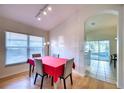 Dining area with red tablecloth and view of kitchen at 6334 Yellowtop Dr, Lakewood Ranch, FL 34202