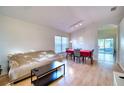 Light-filled dining area with hardwood floors and red tablecloth at 6334 Yellowtop Dr, Lakewood Ranch, FL 34202