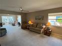 Spacious living room with ample natural light and comfortable seating at 6504 Bowdoin Pl # 15, Bradenton, FL 34207