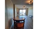 Bright dining area with view to balcony and water at 7050 Sunset S Dr # 601, South Pasadena, FL 33707