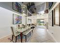 Modern dining room with glass table and artwork at 7325 Skybird Rd # 7325, Bradenton, FL 34209