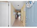 Bright condo entryway leading to the living area at 755 Village Cir # 203, Venice, FL 34292