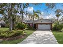 Front view of a brick ranch home with a white garage door at 8009 55Th E St, Palmetto, FL 34221