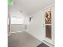 Hallway entrance with white walls and a seashell wreath at 33 S Gulfstream Ave # 808, Sarasota, FL 34236