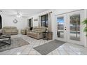 Living room with sliding doors leading to a view of the pool at 1170 Richter St, Port Charlotte, FL 33952