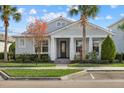 Beautiful house with a welcoming front porch and lush landscaping at 11712 Golden Bay Pl, Bradenton, FL 34211