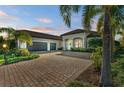 Beautiful two-story home with a tile roof and lush landscaping at 13823 Swiftwater Way, Bradenton, FL 34211