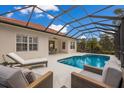 View of the house's back and the screened pool area at 14614 Newtonmore Ln, Lakewood Ranch, FL 34202