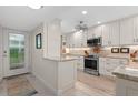 Modern kitchen featuring stainless steel appliances and granite countertops at 1519 Pelican Point Dr # 191, Sarasota, FL 34231