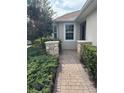 Landscaped walkway leading to the home's entrance at 1910 Scarlett Ave, North Port, FL 34289