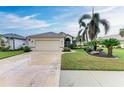 House exterior showcasing a two-car garage and manicured landscaping at 232 Venice Palms Blvd, Venice, FL 34292