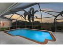 Inviting screened pool area, perfect for relaxation at 232 Venice Palms Blvd, Venice, FL 34292